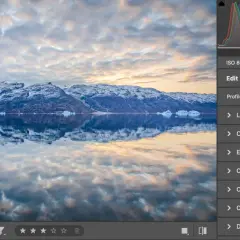 Paisaje ártico con montañas nevadas y reflejos en el agua. Se muestra la interfaz de Photoshop con la opción HDR seleccionada.
