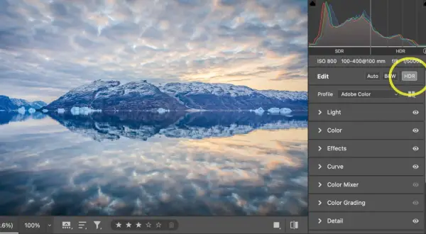 Paisaje ártico con montañas nevadas y reflejos en el agua. Se muestra la interfaz de Photoshop con la opción HDR seleccionada.