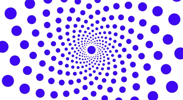 Círculos azules dispuestos en espiral, un ejemplo visual de la ley de semejanza, creando un efecto hipnótico.