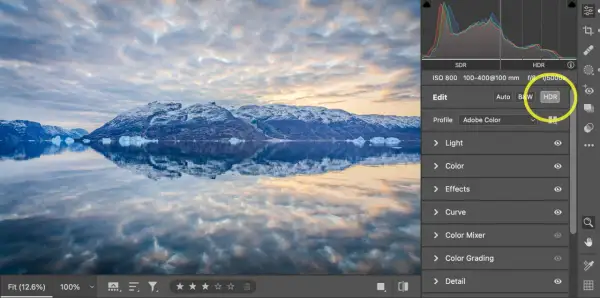 Paisaje ártico con montañas nevadas y reflejos en el agua. Se muestra la interfaz de Photoshop con la opción HDR seleccionada.